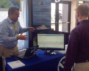 Navigation manager Kyle Ward explains some of Coast Survey's new products at the Savannah Boat Show.