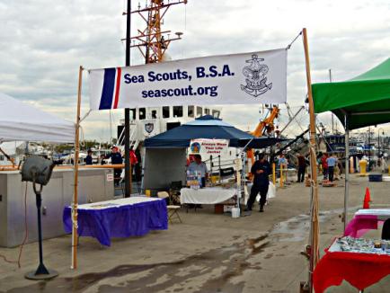 U.S. Coast Guard Cutter Blue Shark in the background, behind the Coast Guard Auxiliary Booth, that looked like part of the Sea Scouts.